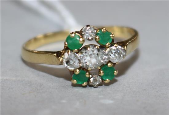 An 18ct gold, emerald and diamond cluster ring, size Q.